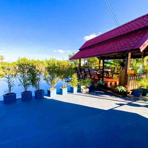 The peaceful fish pond and gazebo at The Better Life Place Rehab in Thailand.