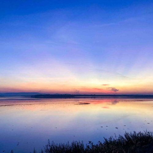 Beautiful sunset at the lake near The Better Life Place Rehab in Thailand.