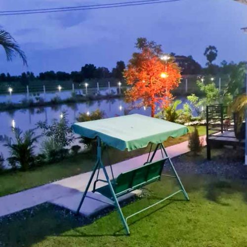 Calm night by the fish pond at The Better Life Place Rehab in Thailand.